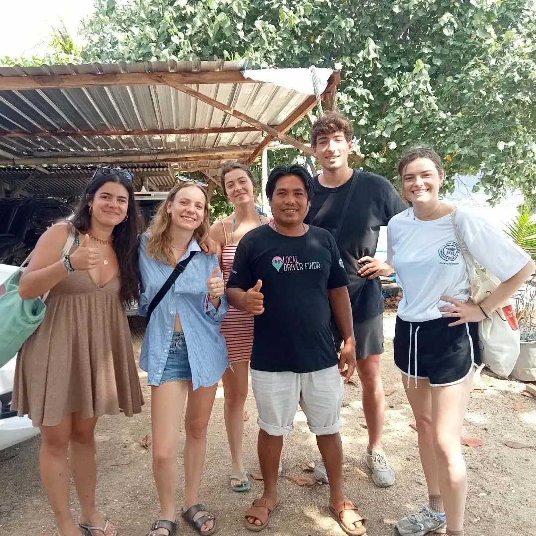 Diko, private driver and tour guide, with guests on a boat trip in Lombok